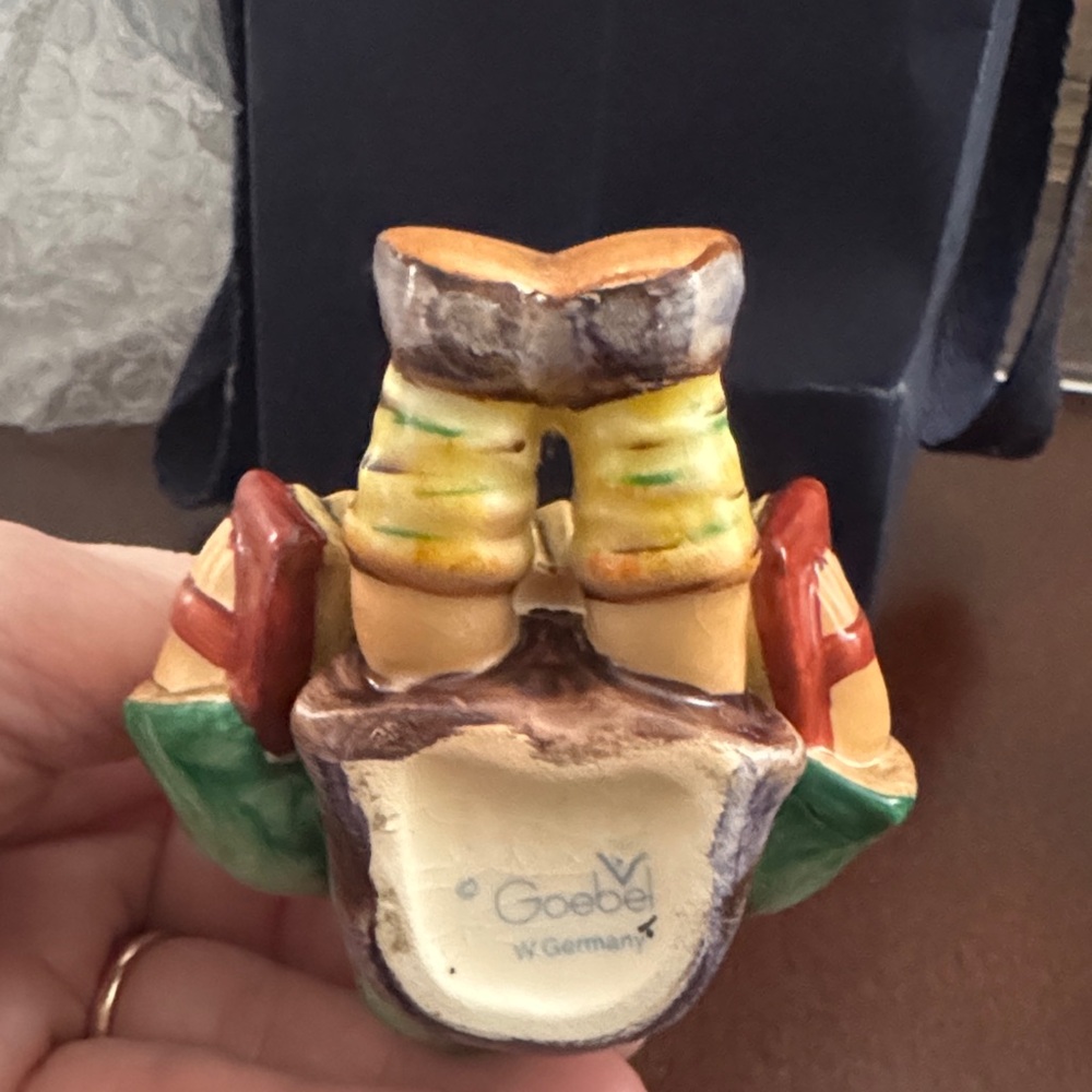 Goebel Figurine with Green, Red, and Cream Accents